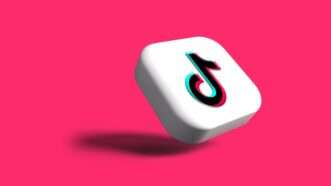 Tiktok logo on hot pink background | Photo by <a href=%40rubaitulazade015-7.html Azad</a> on <a href=a-white-dice-with-a-black-number-on-it-i8nzgv9ajwec09e-7.html   
